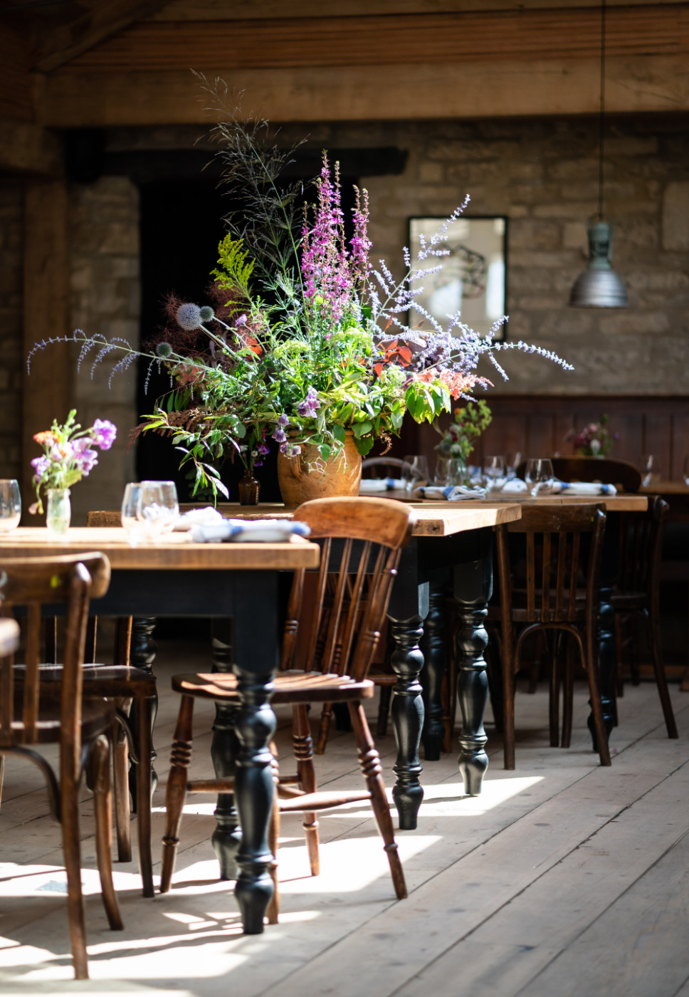 The Barn, our sky-lighted, Oak beamed conservatory restaurant space, showcasing bouquets of British wild flowers crafted by our skilful inhouse florist / hostess
